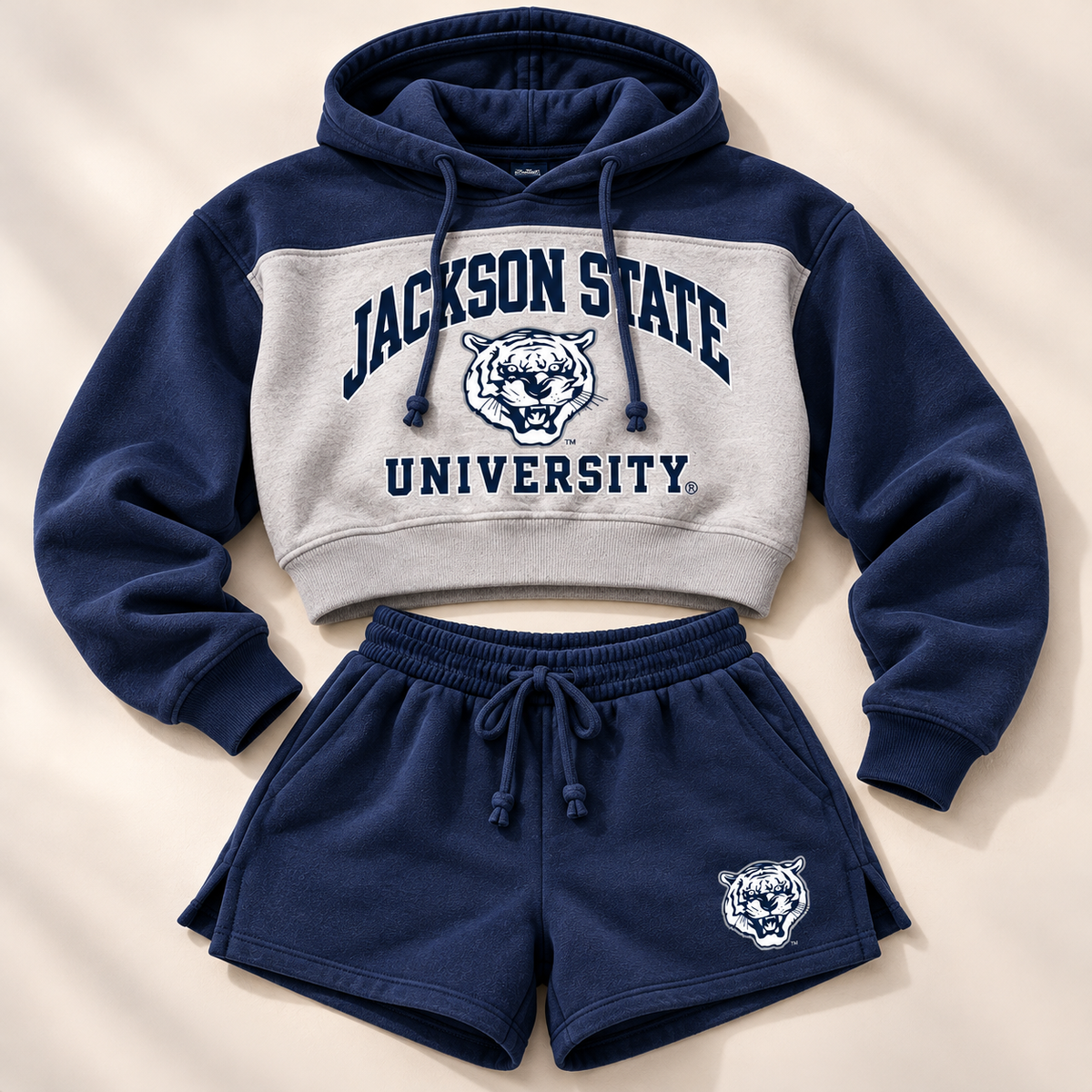 Jackson State Tigers cropped fleece hoodie and navy fleece shorts flat lay