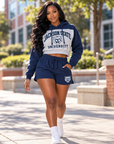 Black woman in Jackson State Tigers cropped fleece collection walking on campus