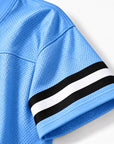 Close-up of Carolina blue Jackson State cropped mesh football jersey sleeve and stripe detail