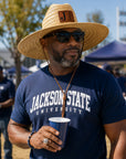 Man wearing Jackson State JSU wide brim straw lifeguard hat with walnut and black leatherette patch at an outdoor gameday event