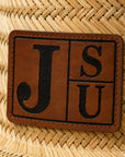 Close-up of walnut and black engraved JSU leatherette patch on Jackson State straw lifeguard hat