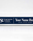 A custom Jackson State University nameplate sign with a navy blue face and silver metal frame, featuring the JSU logo and placeholder text 'Your Name Here' and 'Your Title Here'.