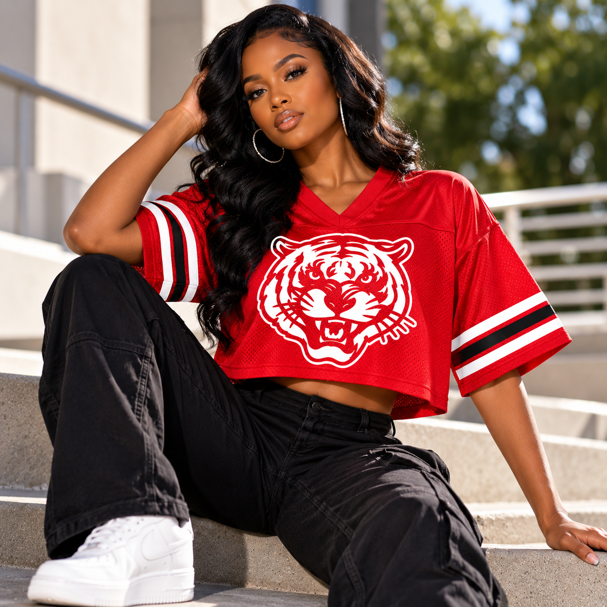 Black woman wearing Jackson State Tigers red cropped mesh football jersey