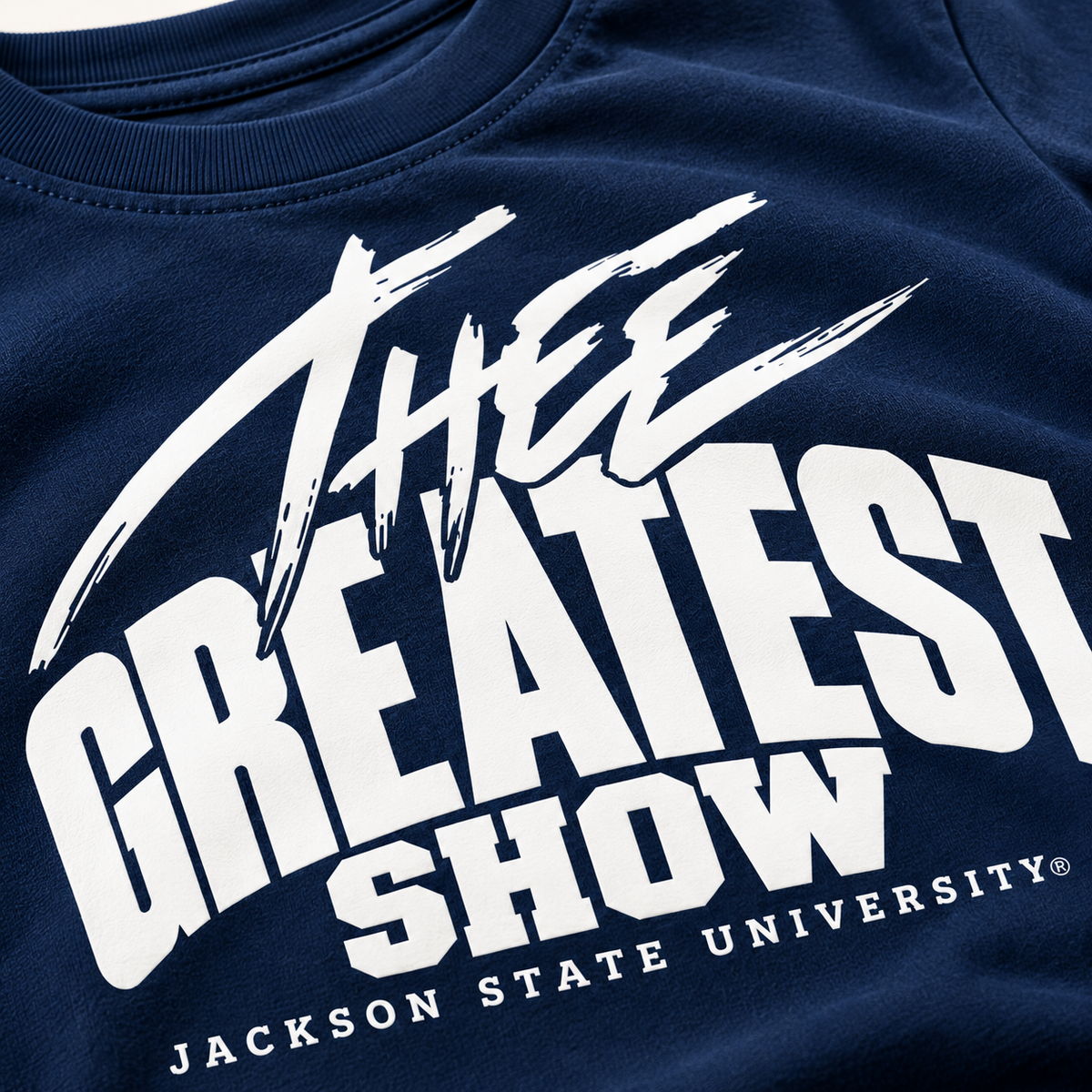 Close-up of Thee Greatest Show print on navy Jackson State youth T-shirt