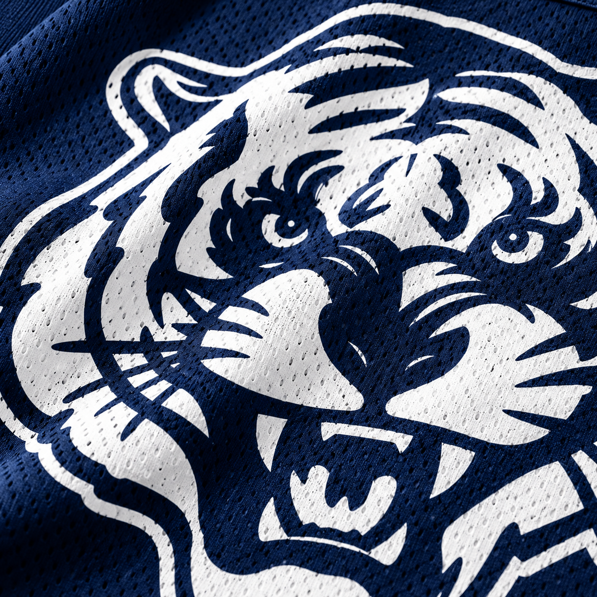 Close-up of white Jackson State Tiger Head print on navy polyester mesh jersey