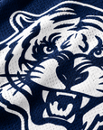 Close-up of white Jackson State Tiger Head print on navy polyester mesh jersey
