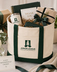 Gift-ready Junior League Palo Alto Mid Peninsula two-tone tote bag styled with accessories