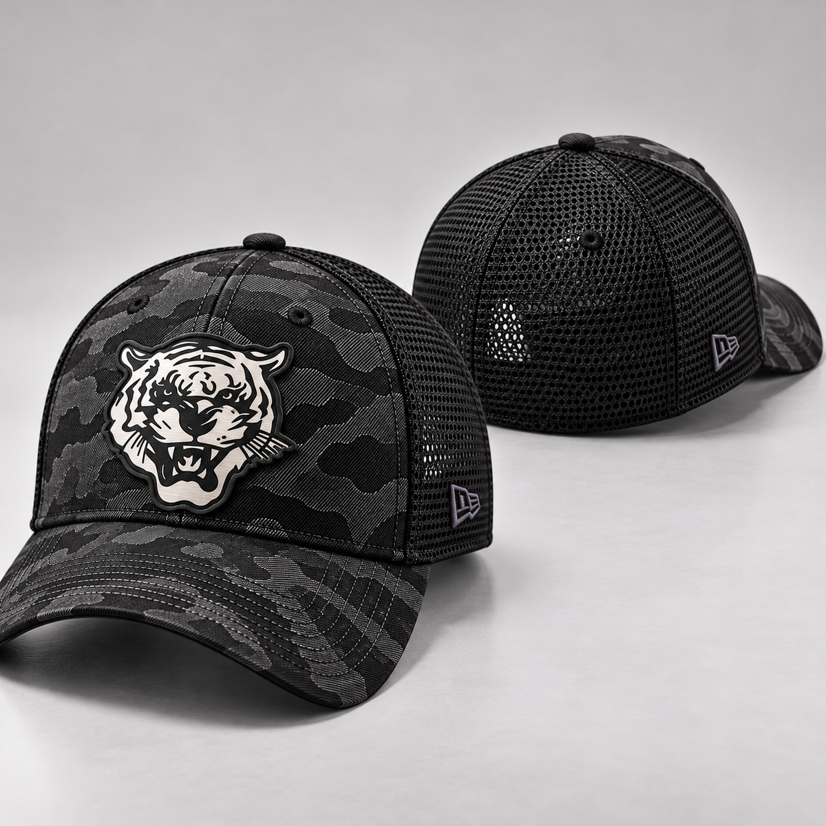 Jackson State Black Camo New Era 39THIRTY Stretch Tech Mesh cap shown from front and rear with Tiger Head patch
