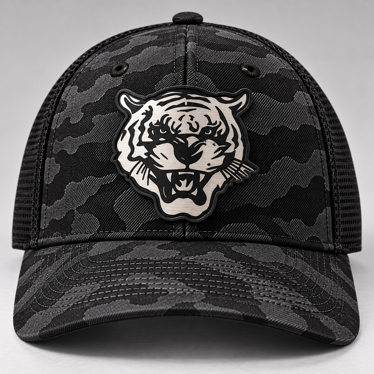Front view of Jackson State Black Camo New Era 39THIRTY Stretch Tech Mesh cap with Tiger Head patch