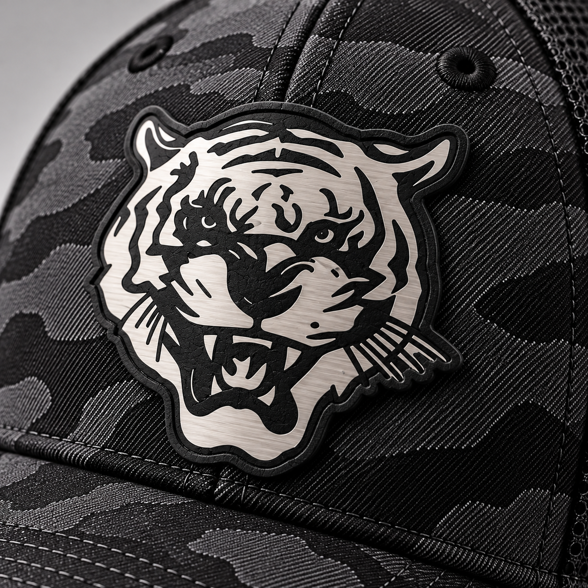 Close-up of Tiger Head black-to-silver leatherette patch on Jackson State Black Camo New Era 39THIRTY cap
