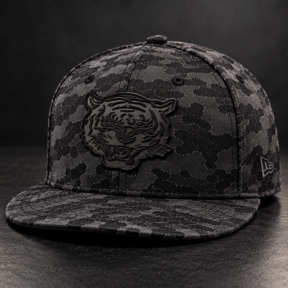 Jackson State Black Camo New Era 9FIFTY flat bill snapback with tone-on-tone black Tiger Head leatherette patch