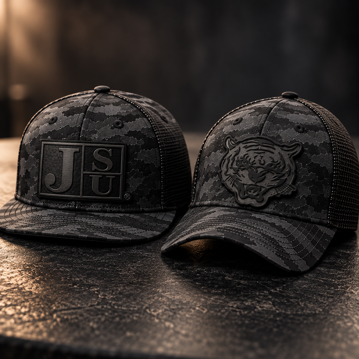 Jackson State Black Camo New Era 9FIFTY and 39THIRTY hats with tone-on-tone black Block JSU and Tiger Head leatherette patches