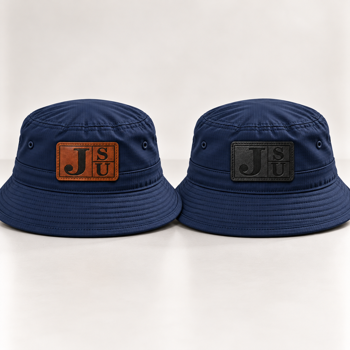 Dress Blue Navy Jackson State Tigers bucket hats comparing walnut and tonal black leatherette JSU patches