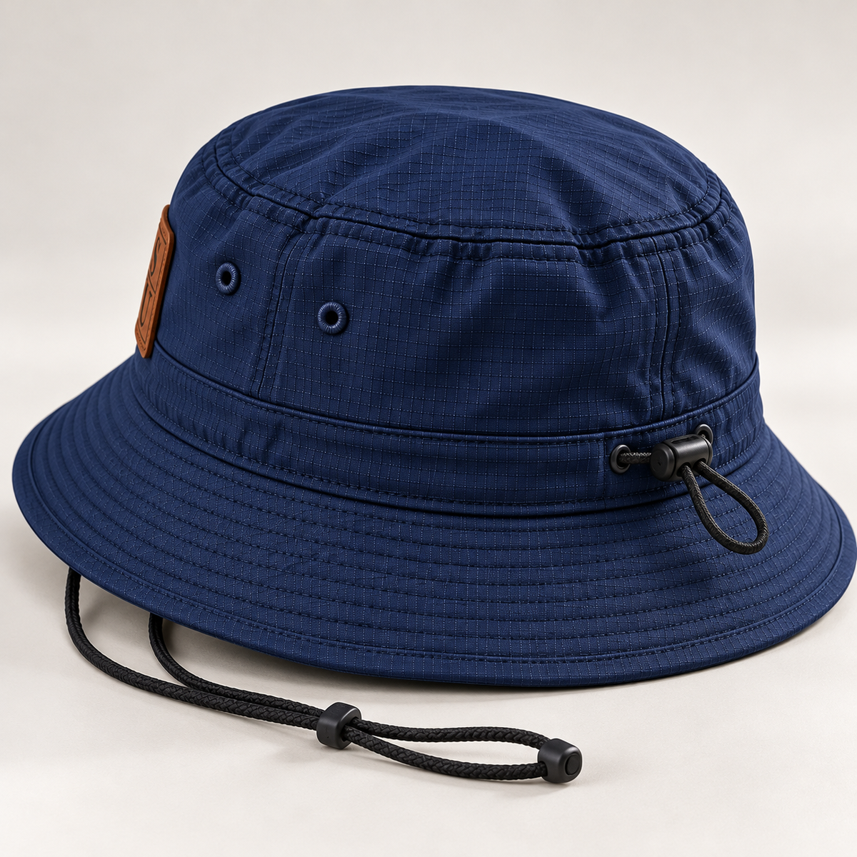 Rear three-quarter detail of Dress Blue Navy Port Authority outdoor bucket hat showing adjustable drawcord and crown toggle