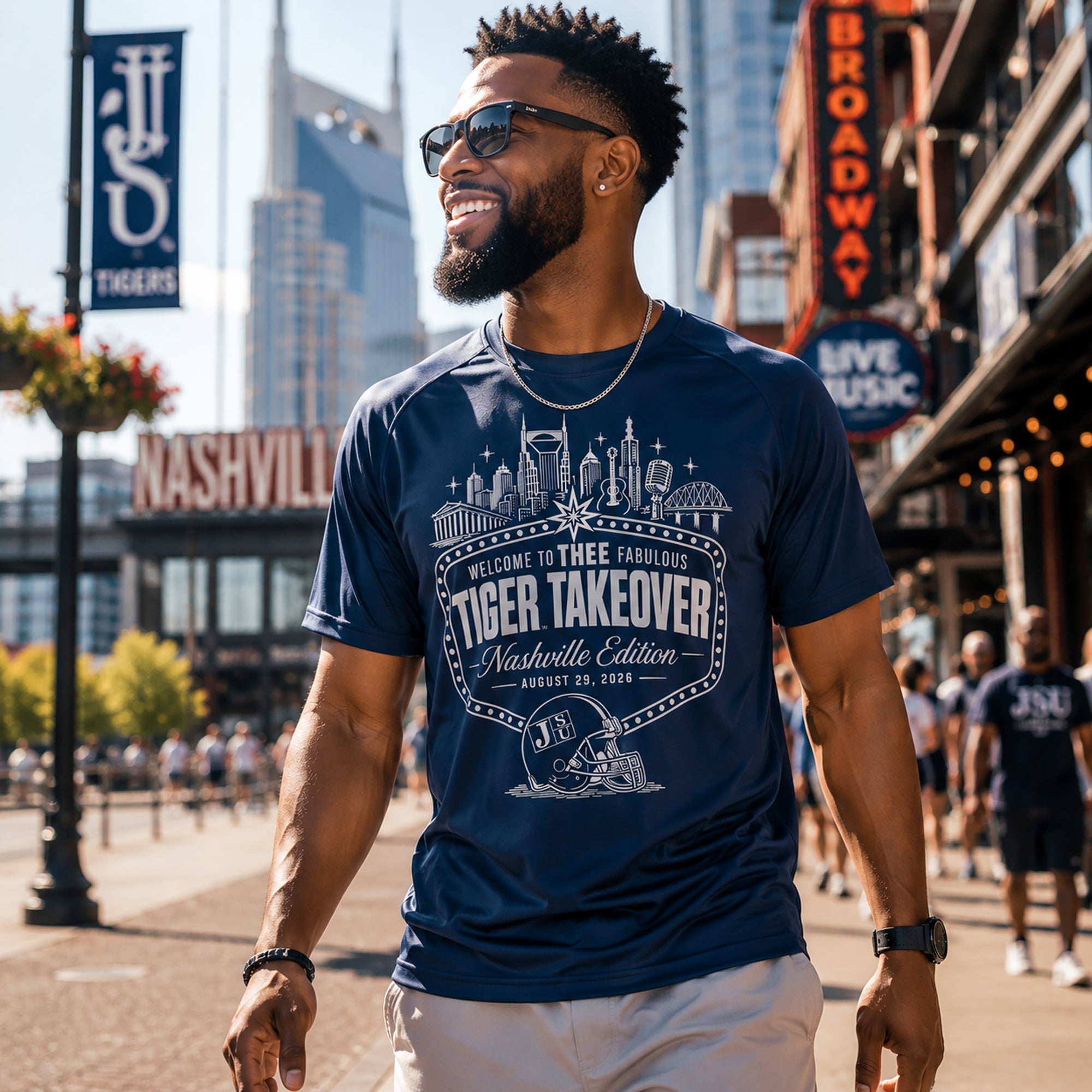 Navy performance t-shirt on a person, featuring front skyline and Tiger Takeover print