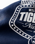 Close-up of navy performance t-shirt fabric with Tiger Takeover logo print