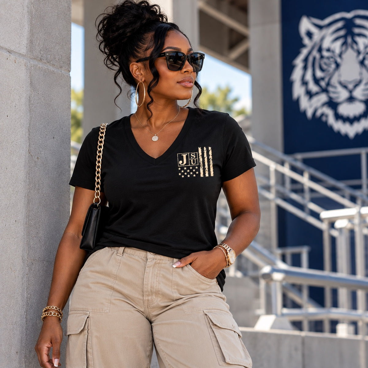 Black woman wearing Jackson State Tigers Salute to Service black V-neck T-shirt