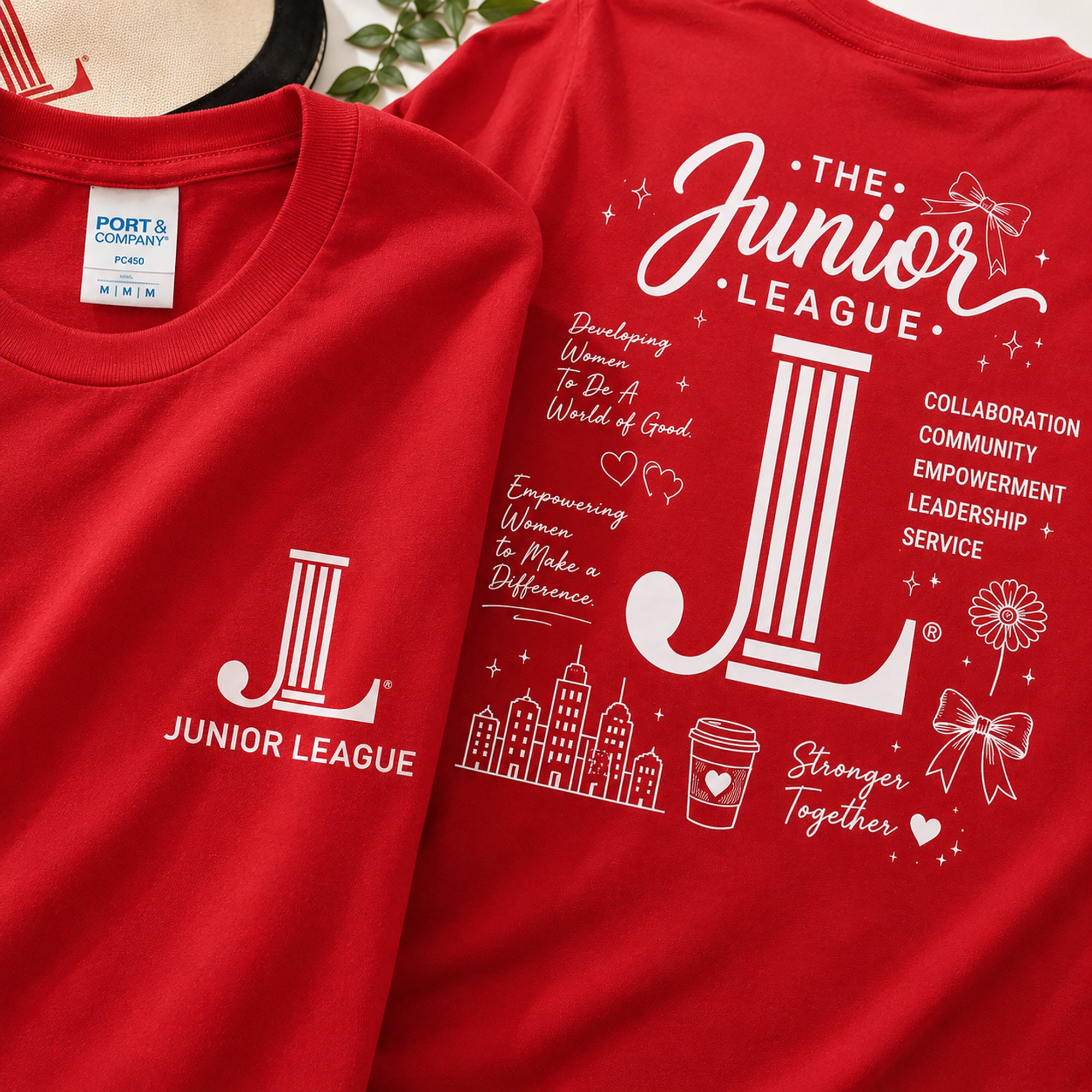 Close-up detail of Junior League Women Who Build Essential Tee showing premium print quality and oversized back graphic