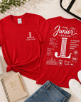 Junior League Women Who Build Essential Tee styled with tote bag, tumbler, notebook, denim, and sneakers in boutique flat lay