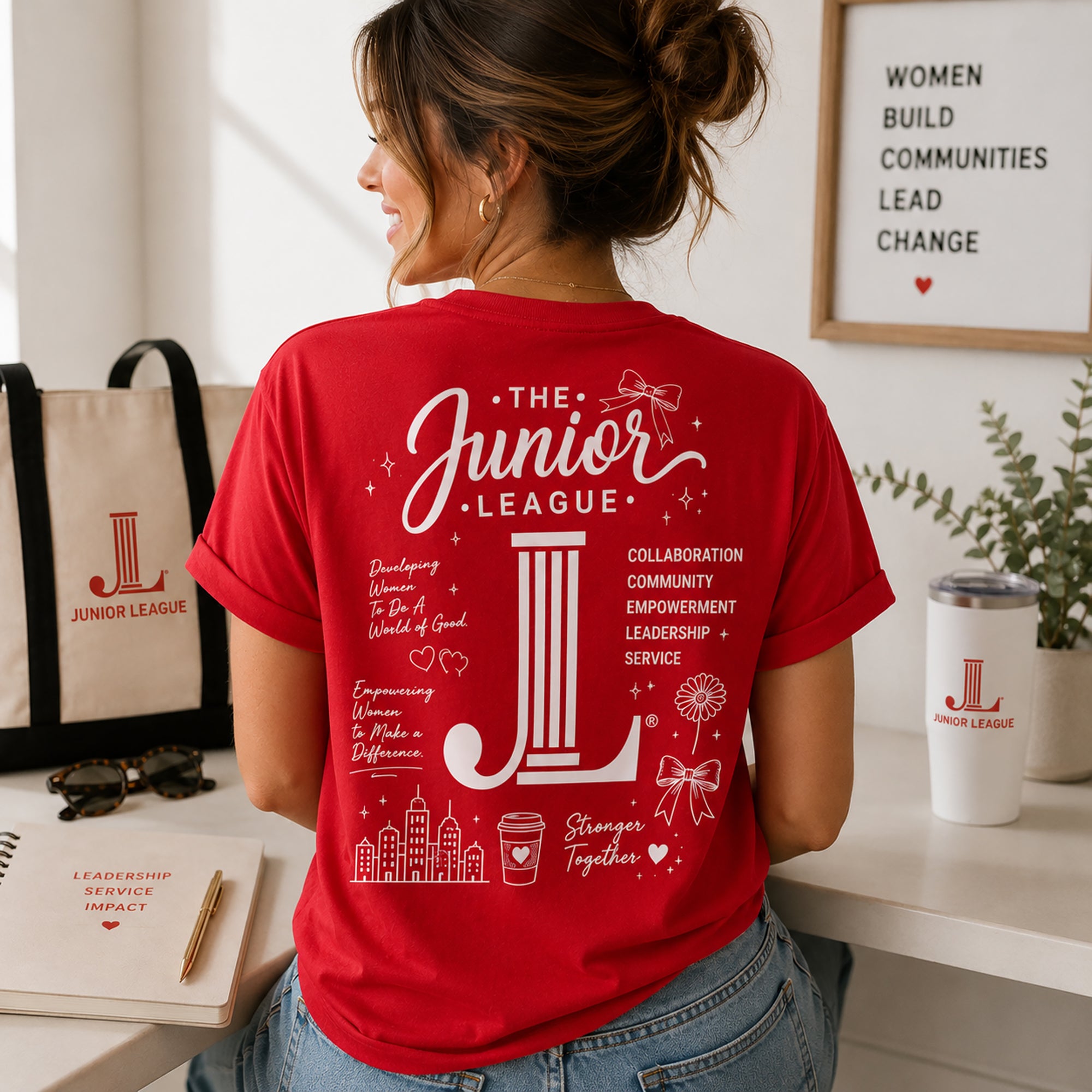Back view of bright red Junior League Women Who Build Essential Tee showing oversized inspirational graphic design