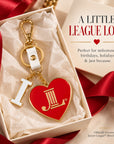 Junior League I Heart JL enamel bag charm presented in an elegant gift box with red ribbon