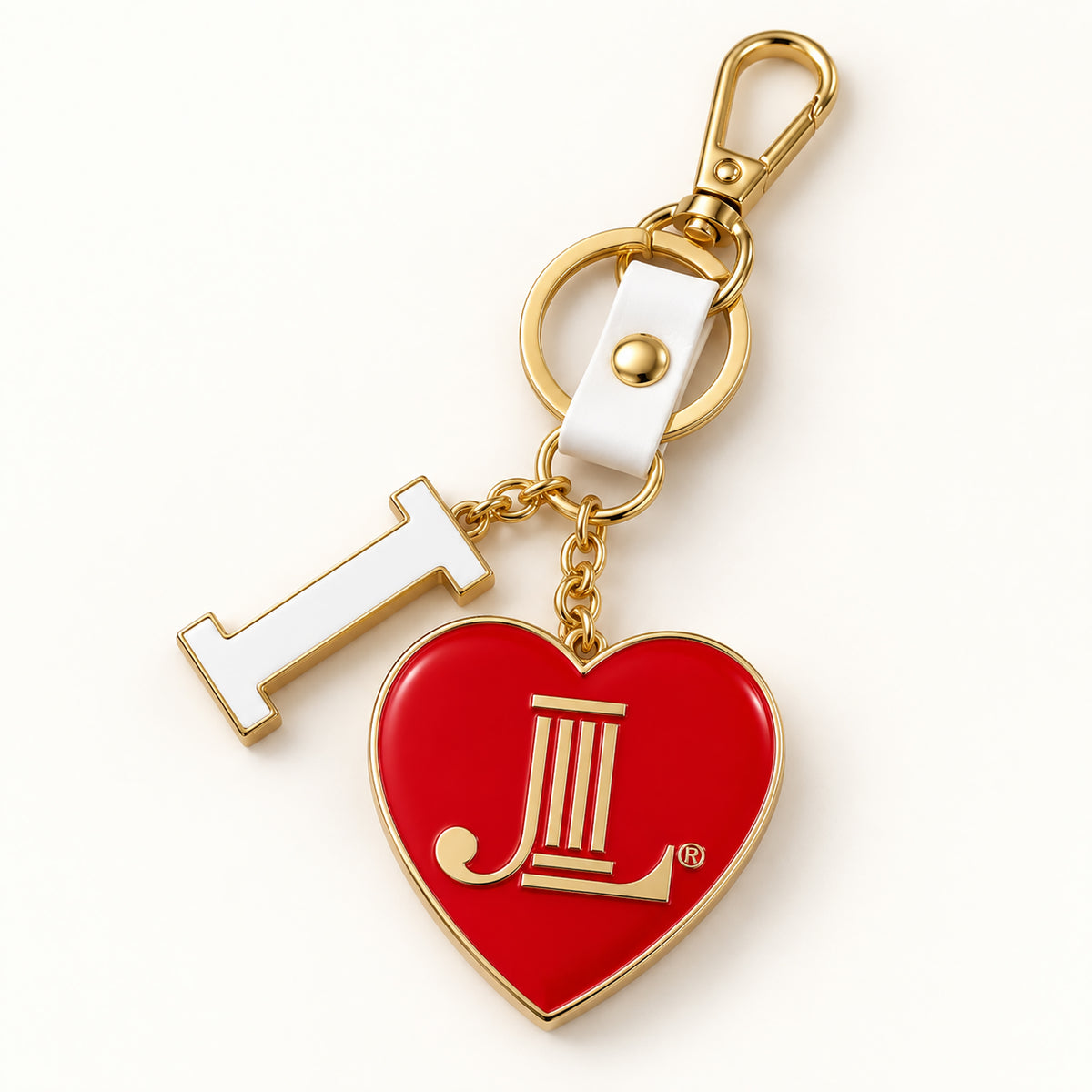 Junior League enamel bag charm keychain with red JL heart, white I charm, gold key ring and lobster clasp