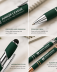 Close-up macro detail of silver laser engraved Junior League logo on hunter green executive stylus pen