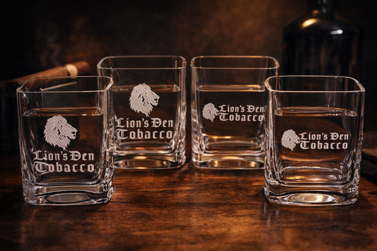 Custom Lion’s Den Tobacco engraved whiskey glass set for cigar lounges, premium barware, and whiskey and cigar enthusiasts.