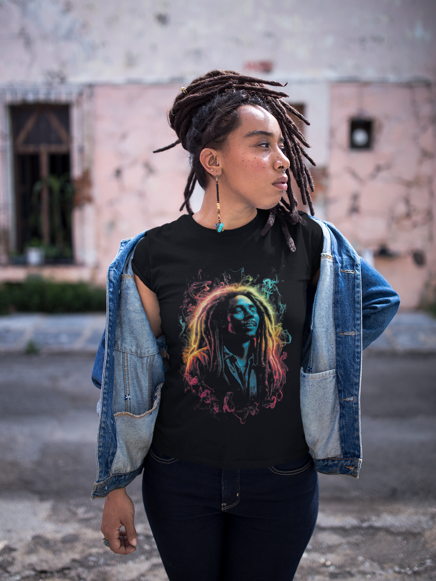Black short-sleeve T-shirt with colorful portrait graphic, side view