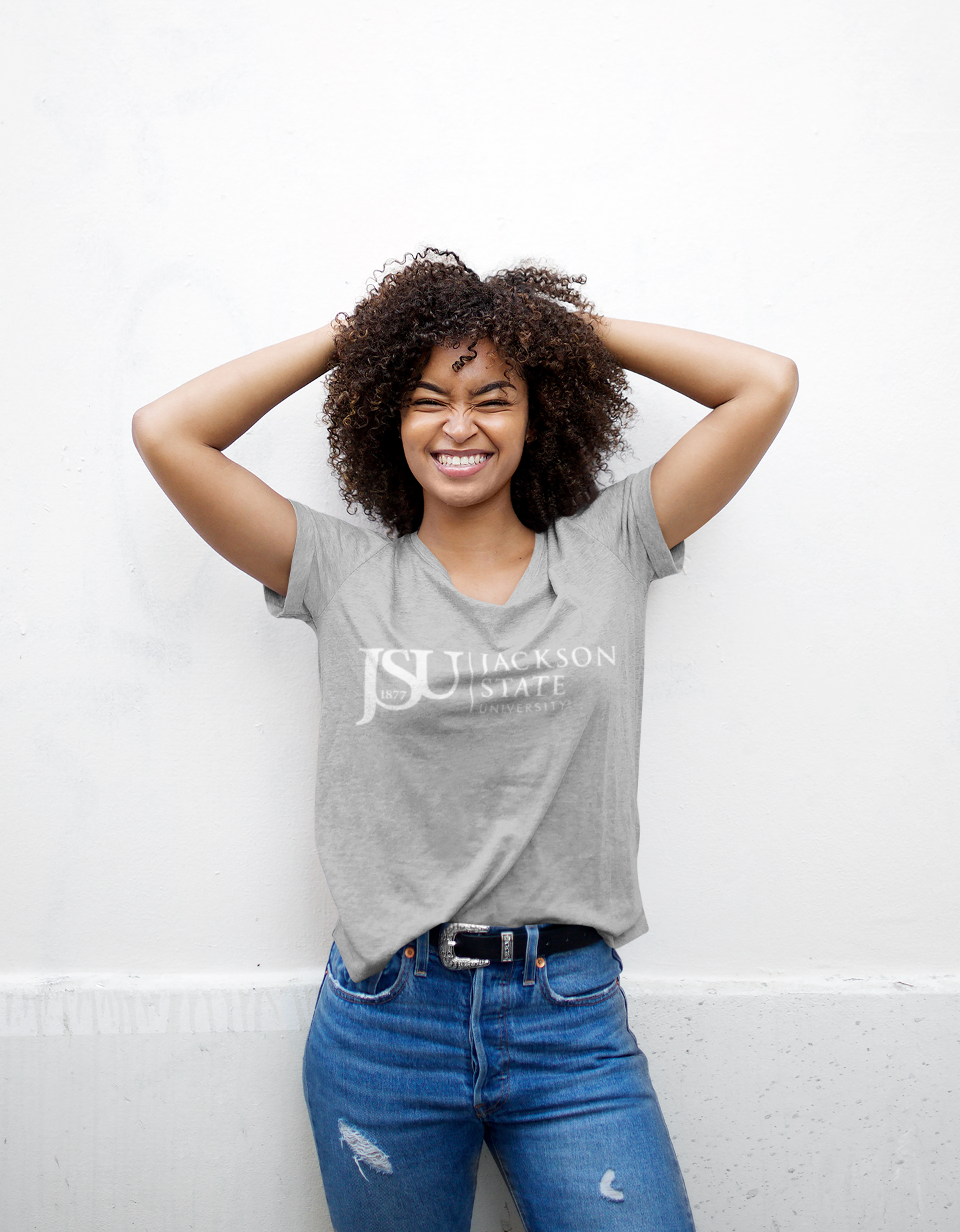 Unisex crew neck athletic heather grey T-shirt with Jackson State logo on chest, model wearing
