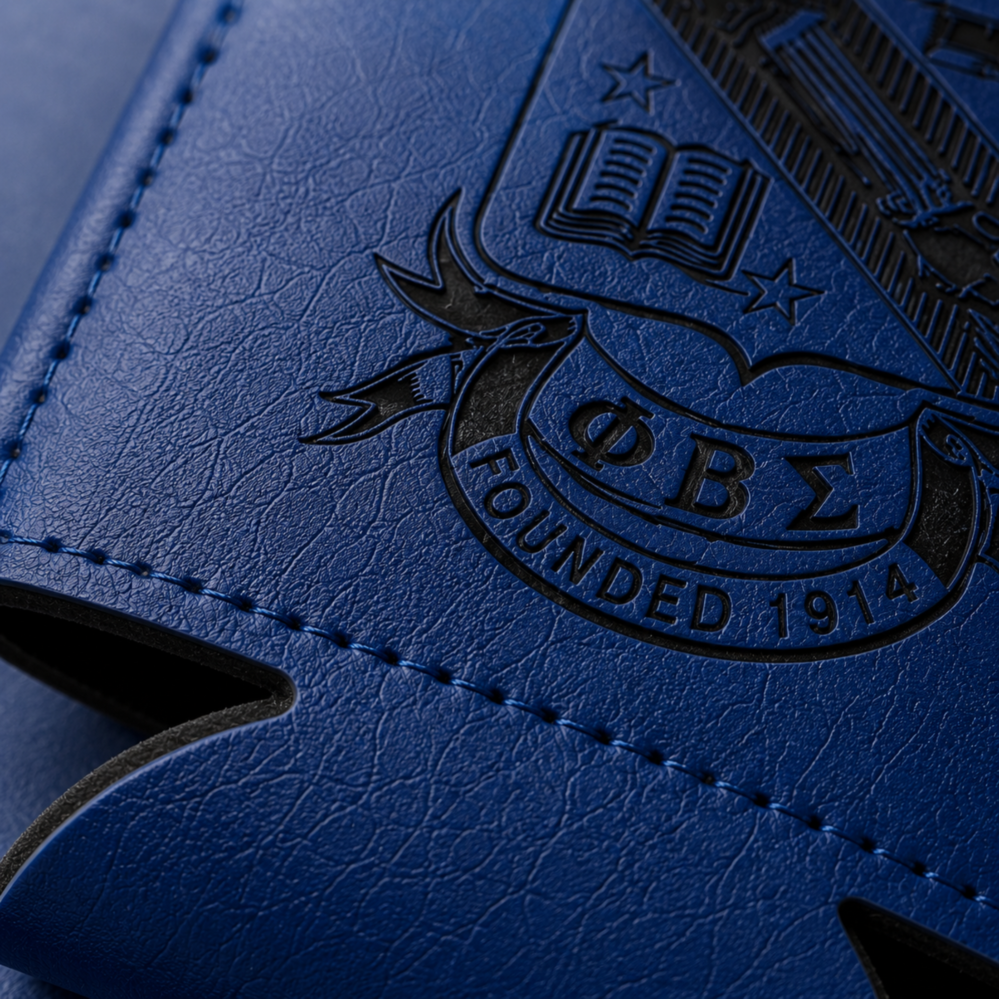 Blue leather-bound book with an embossed logo and text