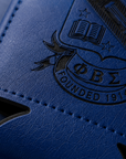 Blue leather-bound book with an embossed logo and text