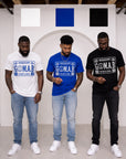 Three men wearing white, blue, and black G.O.M.A.B. Phi Beta Sigma T-shirts