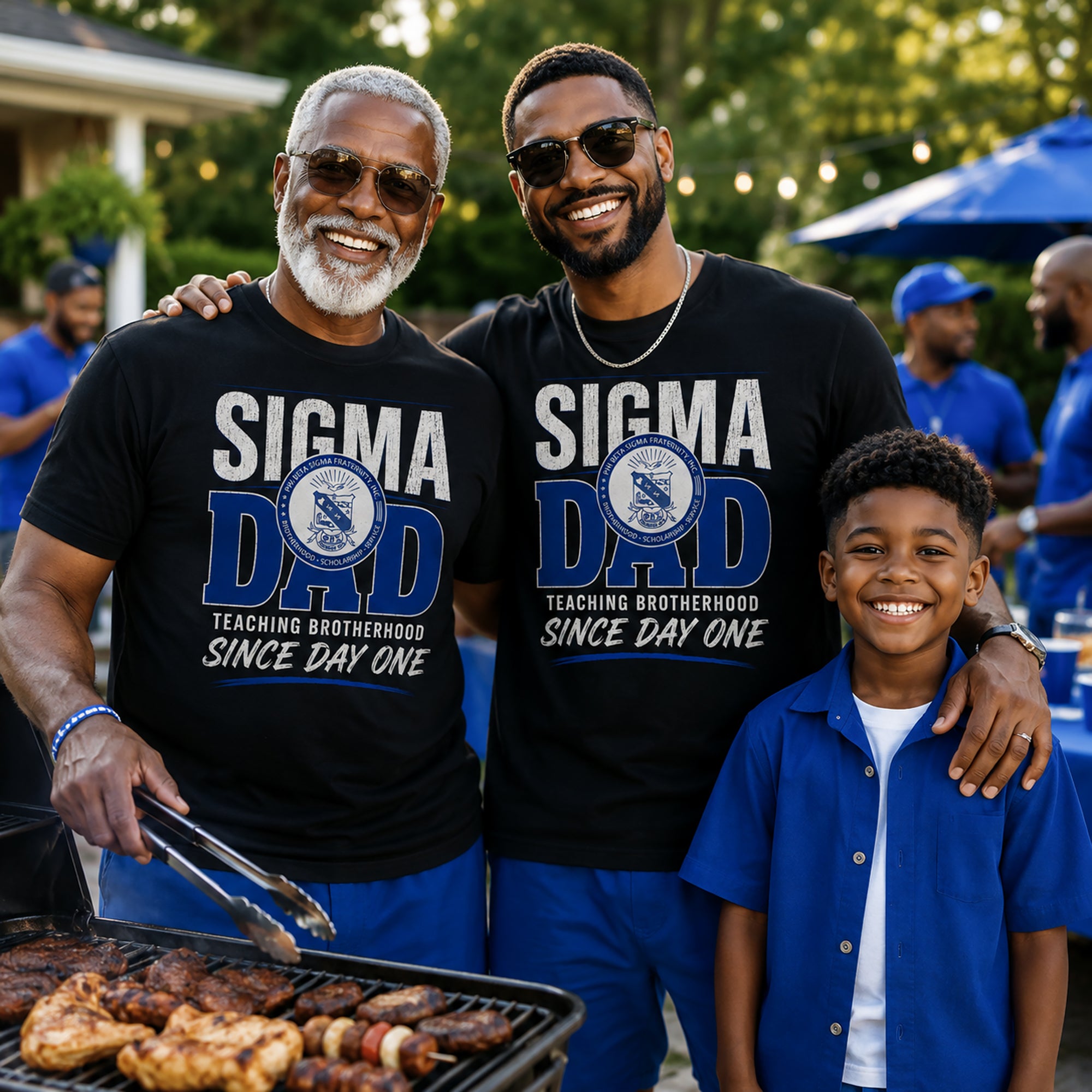 Grandfather, dad, and son wearing 'Sigma Dad' shirts standing around a grill outdoors.