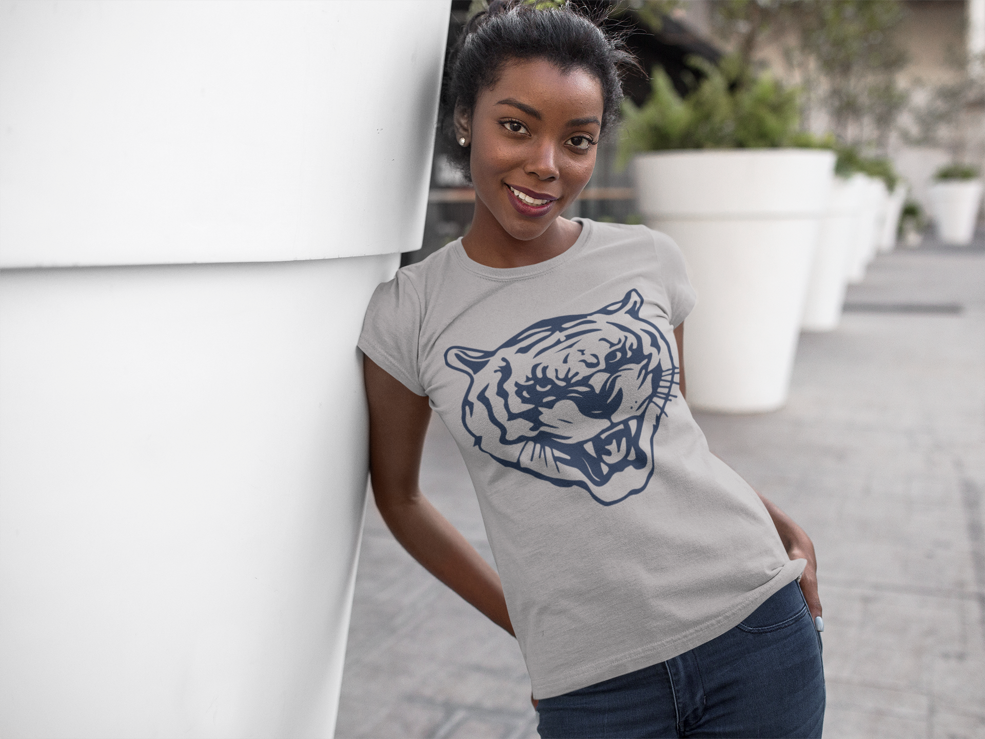 Athletic heather gray crewneck T-shirt with blue tiger head logo, worn outdoors