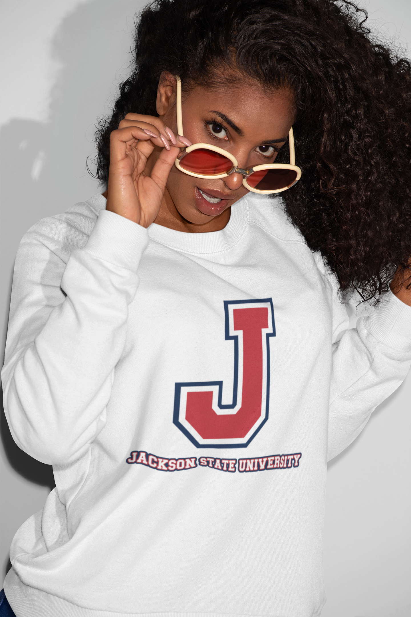 White unisex crewneck sweatshirt with large J logo graphic at center chest