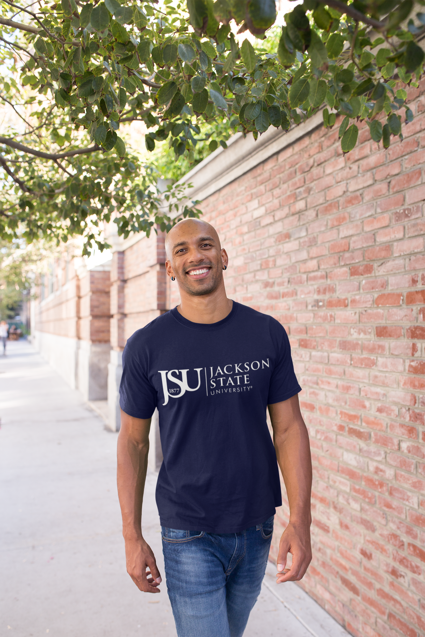 Unisex crew neck navy T-shirt with Jackson State logo on chest, model wearing