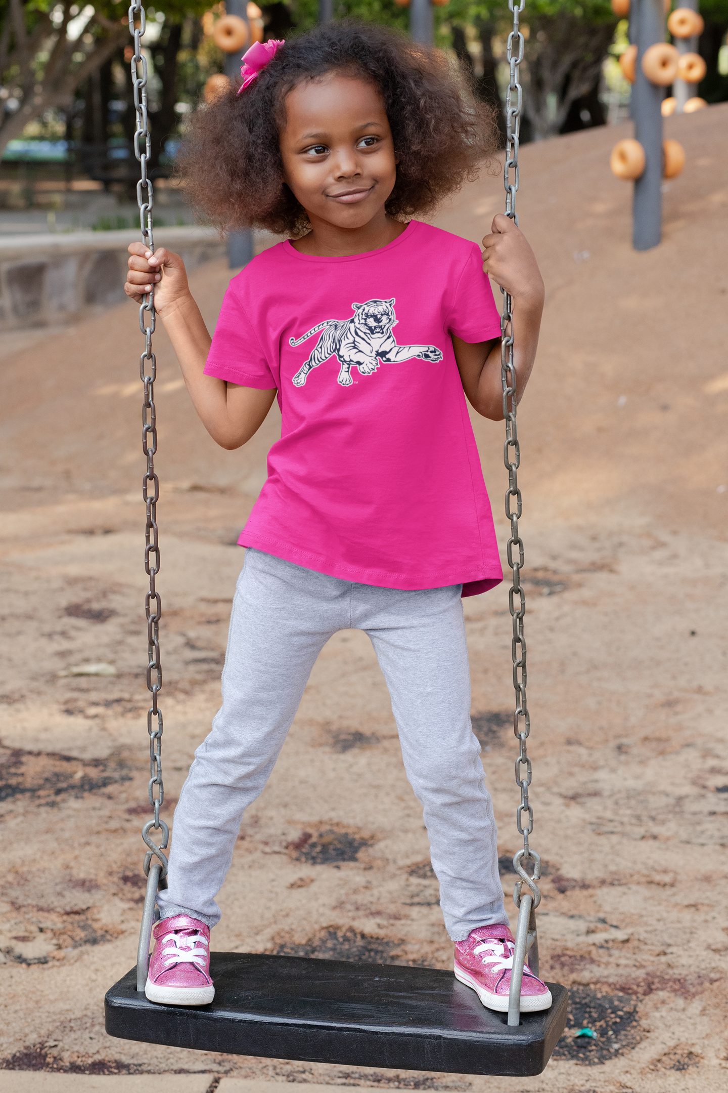 Pink short-sleeve T-shirt with leaping tiger graphic on the chest