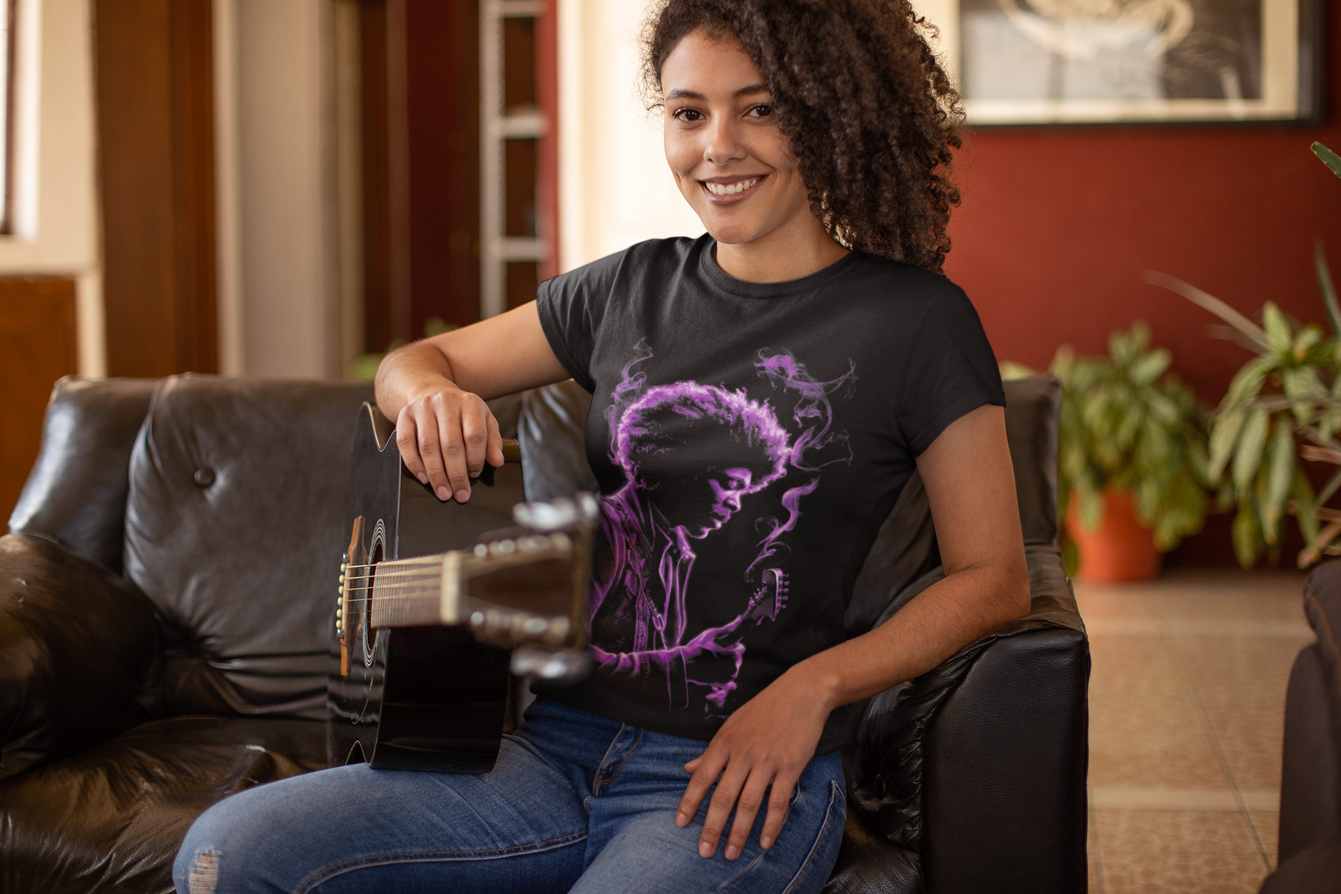 Black short-sleeve T-shirt with purple portrait graphic, on model