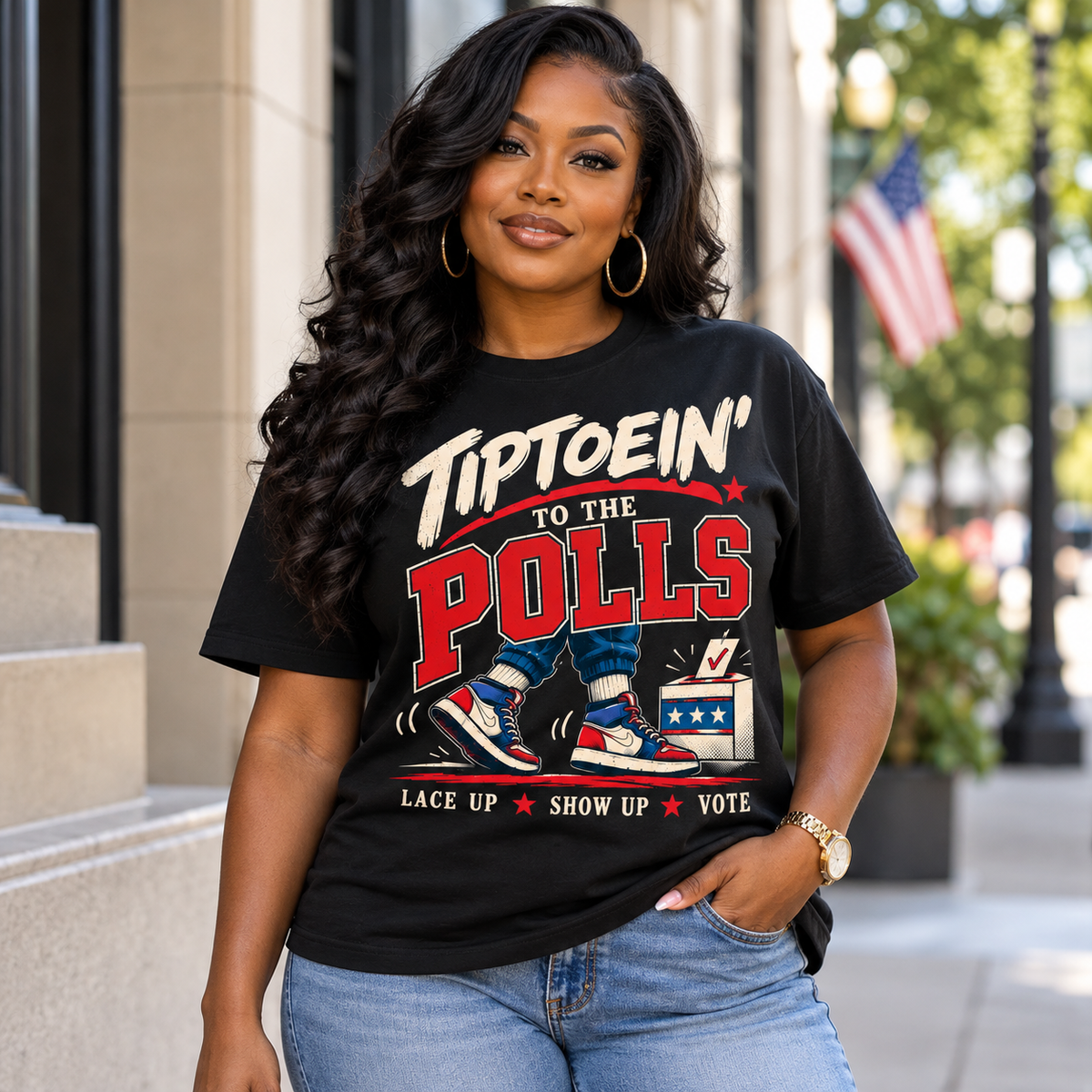Black woman wearing the black Tiptoein’ to the Polls T-shirt