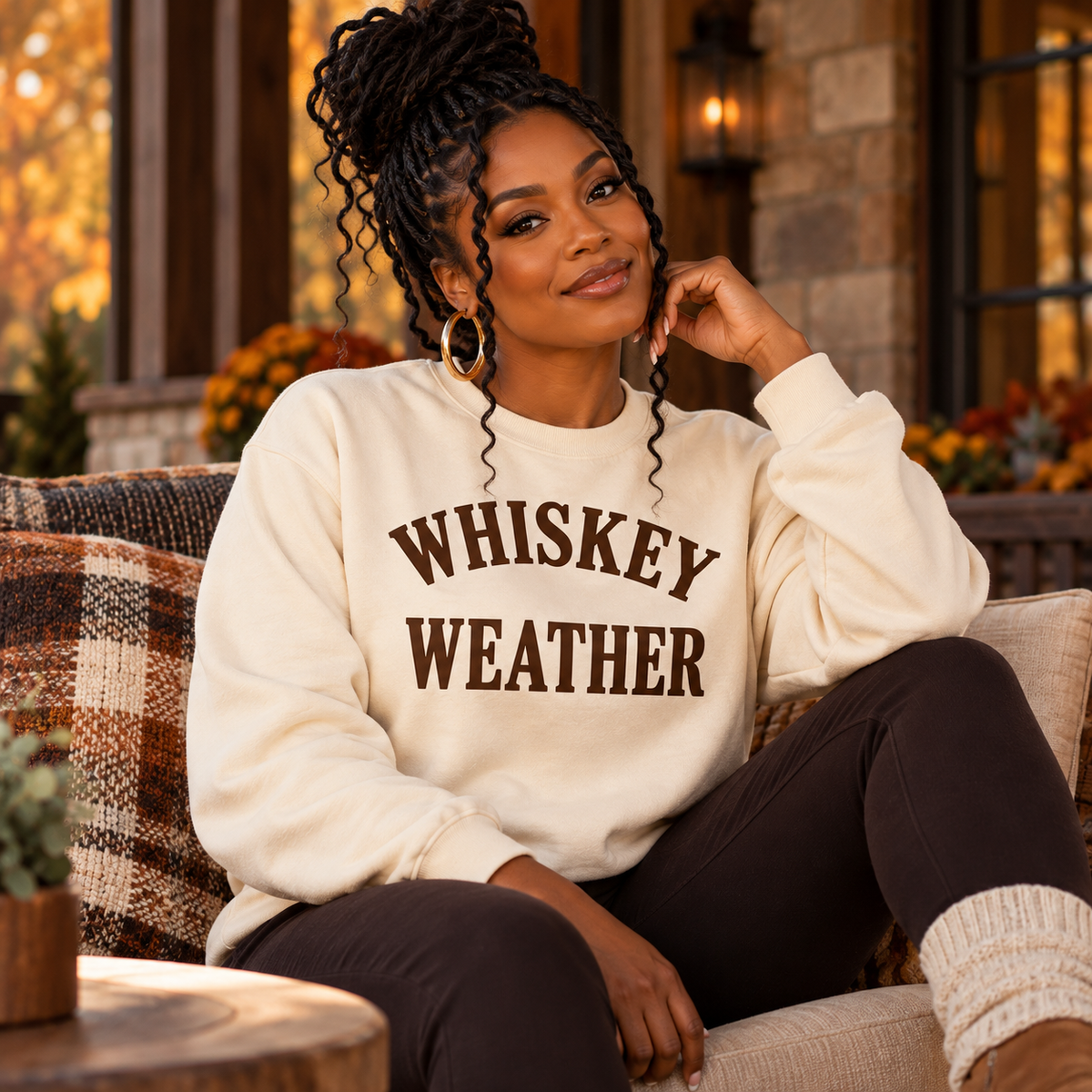 Black woman wearing Natural Whiskey Weather crewneck sweatshirt with dark chocolate brown print