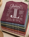 Folded stack of Women Who Build garment dyed tees in multiple boutique-inspired colorways