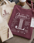 Women Who Build Beach Wash Tee styled with conference accessories including tote bag and notebook