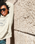 Unisex pullover hoodie in sweet cream heather with stadium graphic, hood, kangaroo pocket