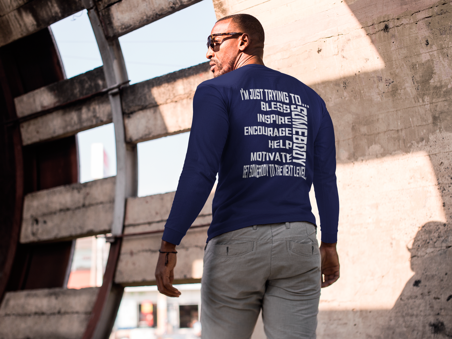 Navy blue unisex short sleeve crew neck T-shirt with white motivational text graphic on back