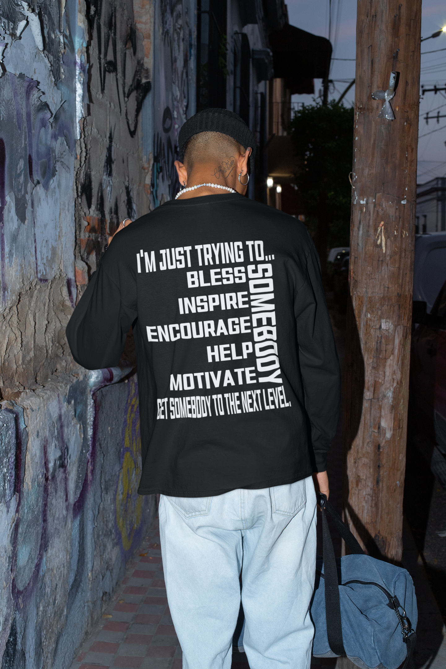 Black unisex crew neck long sleeve T-shirt with bold white back slogan text