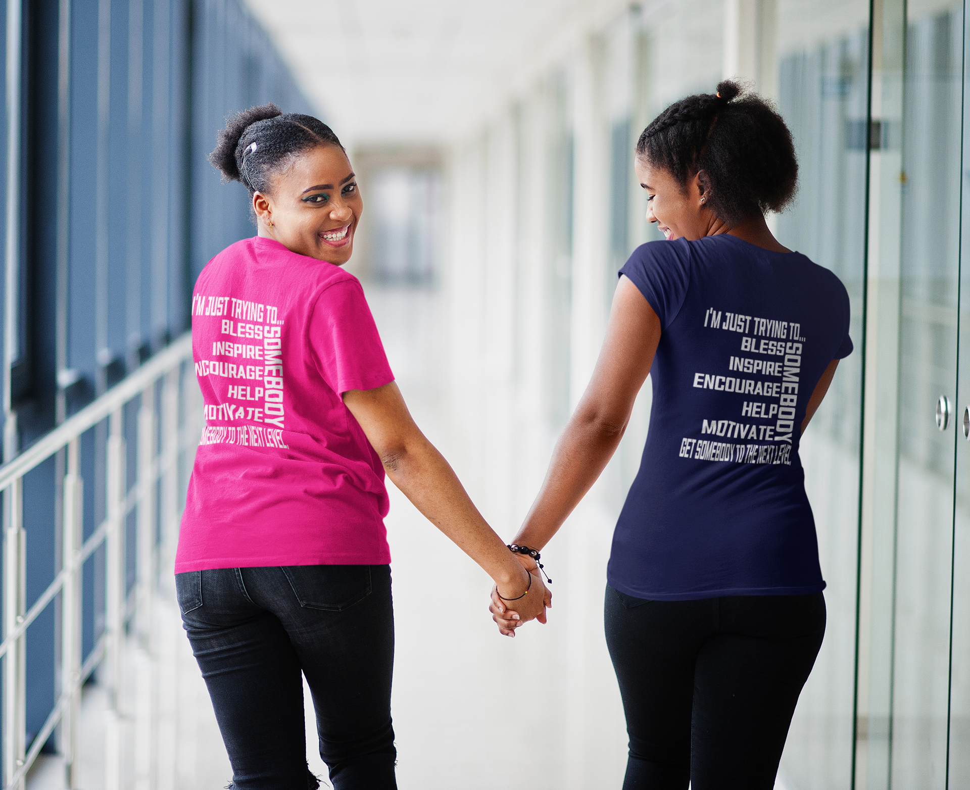 Pink and navy unisex short sleeve crew neck T-shirts with white motivational text graphics