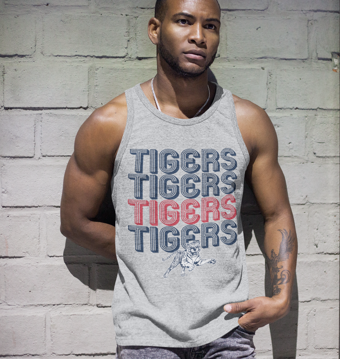 Heather grey graphic tank with multicolor TIGERS lettering and tiger mascot print, worn