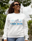 White crewneck sweatshirt with Code Blue graphic on chest, worn outdoors