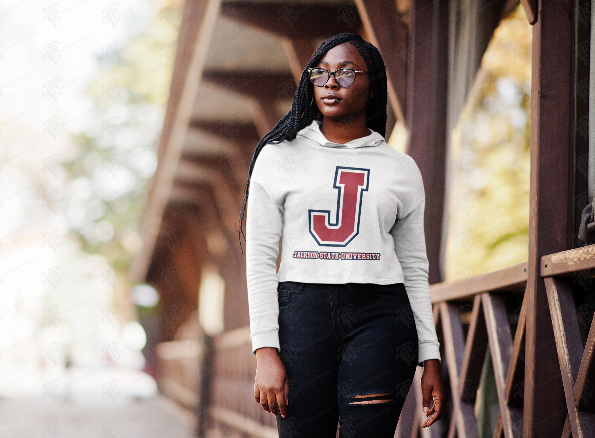 White cropped pullover hoodie on model with hood and drawstring, long sleeves